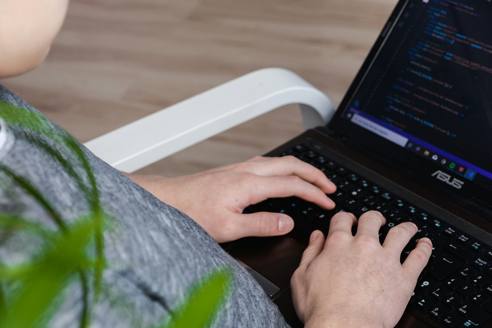 person using computer on table