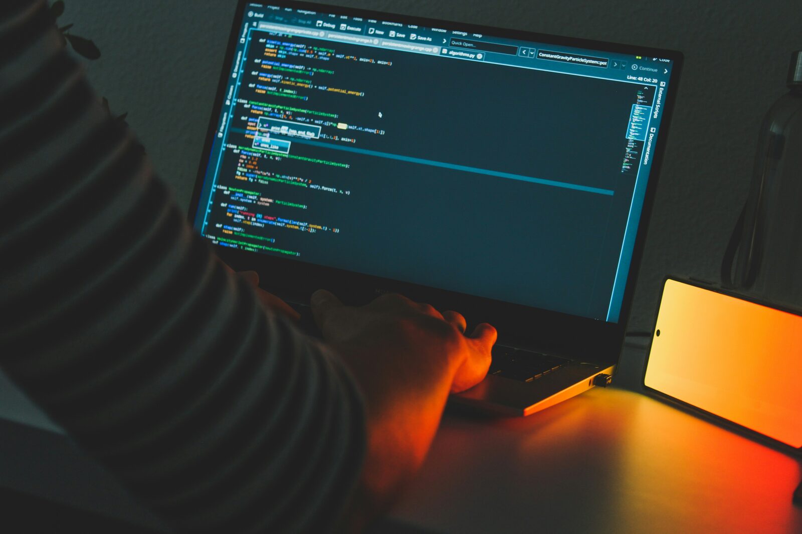 person using computer on table